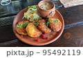 Potato pancakes with sauce, sauerkraut. Studio Photo 95492119