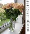 Bouquet of fresh roses in crystal vase. Studio Photo 95492143