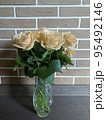 Bouquet of fresh roses in crystal vase. Studio Photo 95492146