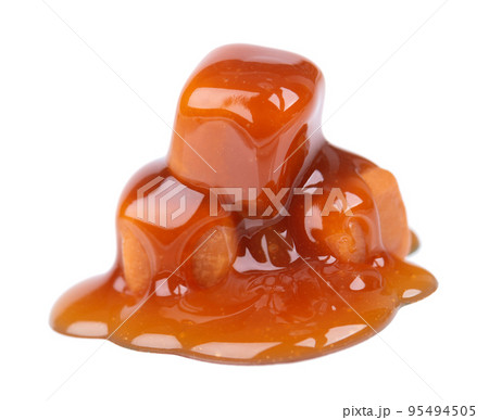Sweet caramel candies and sauce, isolated on white background. Delicious caramel. Sweet caramel candies and sauce, isolated on white background. Delicious caramel. 95494505