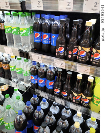 JOHOR, MALAYSIA -MARCH 1, 2022: Soft drinks or carbonated drinks displayed for sale in the supermarket. Have a price tag to make it easier for customers to buy. JOHOR, MALAYSIA -MARCH 1, 2022: Soft drinks or carbonated drinks displayed for sale in the supermarket. Have a price tag to make it easier for customers to buy. 95495641