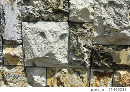 Artificial stone cladding. Designed to resemble real stone. Arranged vertically and attached to the wall with a special adhesive. Used as decoration on the walls of buildings. Artificial stone cladding. Designed to resemble real stone. Arranged vertically and attached to the wall with a special adhesive. Used as decoration on the walls of buildings. 95496251