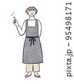人差し指を上げるエプロンの女性 95498171