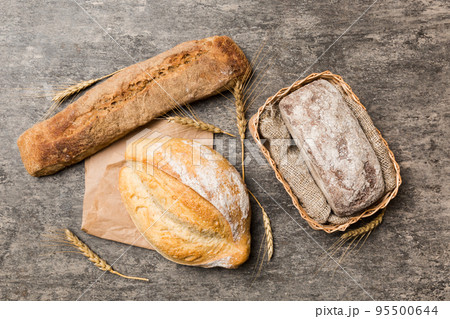 Freshly baked bread on basket against natural background. top view bread copy space 95500644