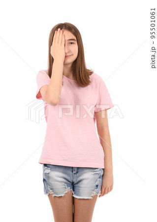 Young beautiful girl in a pink t-shirt and denim shorts on a white background Young beautiful girl in a pink t-shirt and denim shorts on a white background 95501061