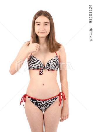 Young beautiful girl in a swimsuit on a white background Young beautiful girl in a swimsuit on a white background 95501124