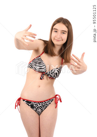 Young beautiful girl in a swimsuit on a white background 95501125