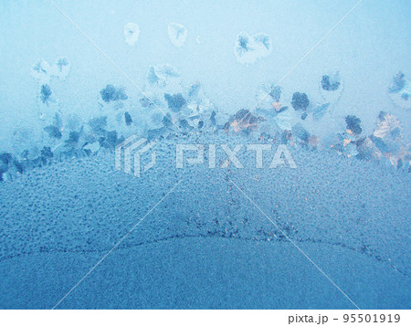 Texture frozen window glass. Blue frozen window 95501919