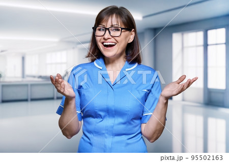Portrait of a female nurse inside the hospital 95502163