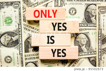 Only yes is yes symbol. Concept words Only yes is yes on wooden blocks on a beautiful background from dollar bills. Business, psychological only yes is yes concept. 95502673