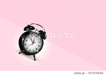 Black vintage alarm clock rolls down the slope with colored background. 95504690