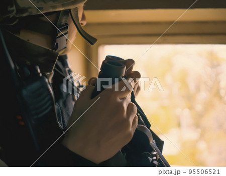 A Man with a binocular and in the military uniform. A Man with a binocular and in the military uniform. 95506521