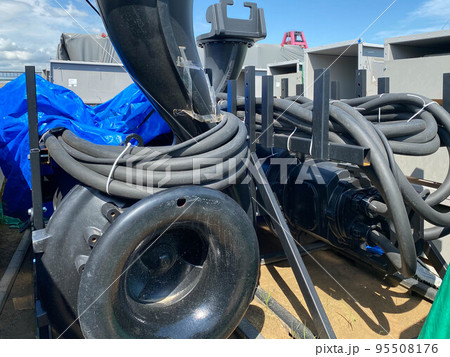 A large pump with an impeller and an impeller stands in a storage warehouse prepared for installation of industrial metal equipment for an oil refinery and petrochemical plant 95508176