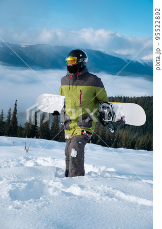 man snowboarder portrait carpathian mountains on background 95522892