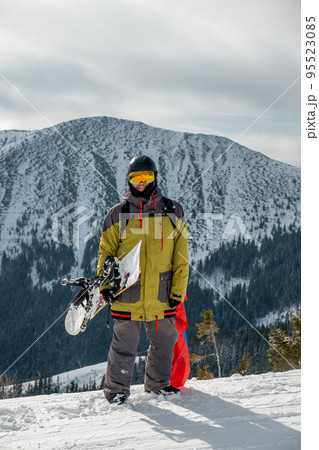 man snowboarder with slovakia flag at ski resort slope man snowboarder with slovakia flag at ski resort slope 95523085
