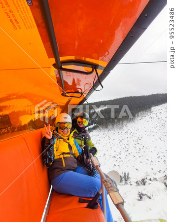 couple picture at ski chair lift couple picture at ski chair lift 95523486