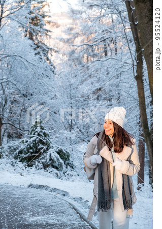 smiling woman walking by winter park 95524120