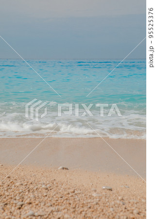 sea beach with white rocks and blue water 95525376