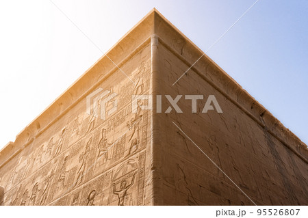 Egyptian building with hieroglyphs engraved on the facade Egyptian building with hieroglyphs engraved on the facade 95526807