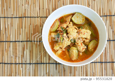 spicy boiled chicken with eggplant in curry soup on bowl spicy boiled chicken with eggplant in curry soup on bowl 95531820