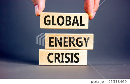 Global energy crisis symbol. Concept words Global energy crisis on wooden blocks. Businessman hand. Beautiful grey table grey background. Business and global energy crisis concept. Copy space. Global energy crisis symbol. Concept words Global energy crisis on wooden blocks. Businessman hand. Beautiful grey table grey background. Business and global energy crisis concept. Copy space. 95538469