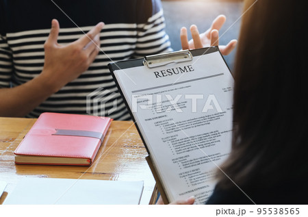 focus resume document with HR discussion job interview with answers from women applying for jobs focus resume document with HR discussion job interview with answers from women applying for jobs 95538565
