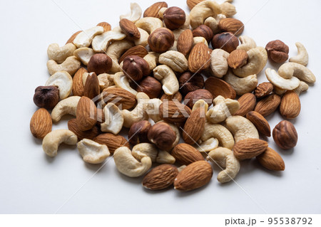 Various nuts on a white background close-up. 95538792