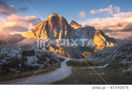 Mountains and sky with colorful clouds at sunset in autumn Mountains and sky with colorful clouds at sunset in autumn 95540876