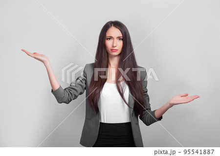 Surprised businesswoman dshows your product with her hand. 95541887