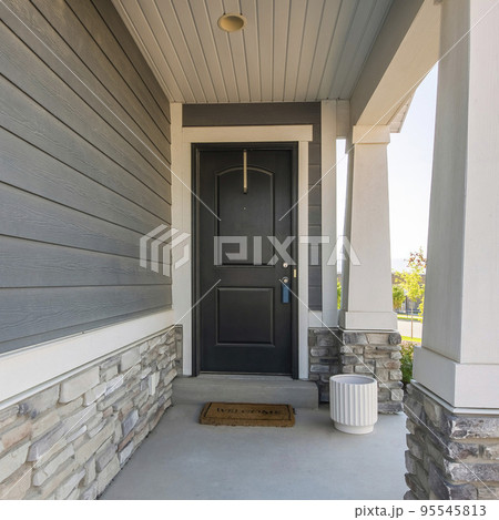 Square Black front door exterior of a house with lockbox and doormat Square Black front door exterior of a house with lockbox and doormat 95545813