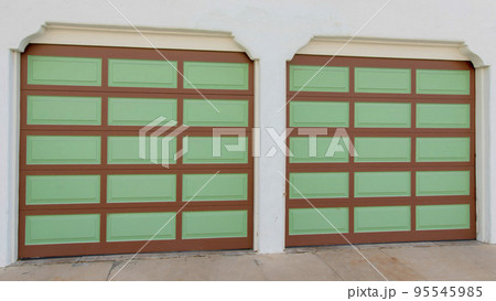 Panorama Two garage doors with brown grid lines and green panels at La Jolla, California Panorama Two garage doors with brown grid lines and green panels at La Jolla, California 95545985
