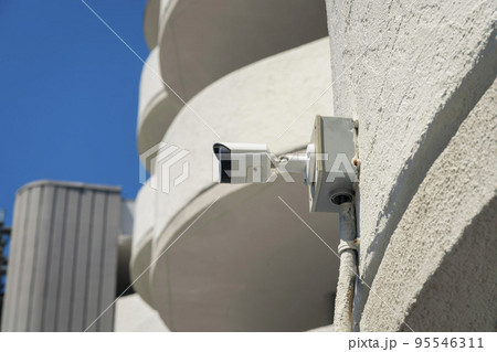 Security surveillance video camera on modern building in Destin Florida Security surveillance video camera on modern building in Destin Florida 95546311