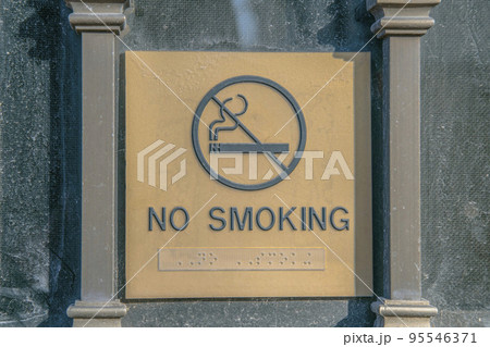 No Smoking sign embossed on exterior wall of a building in San Antonio Texas No Smoking sign embossed on exterior wall of a building in San Antonio Texas 95546371