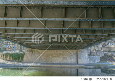 Underside of a bridge that runs over the canal in San Antonio River Walk Texas 95546416