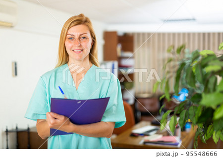 Female doctor assistant standing in medical office 95548666