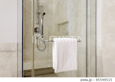 Clean towel on rack in bathroom Clean towel on rack in bathroom 95549515