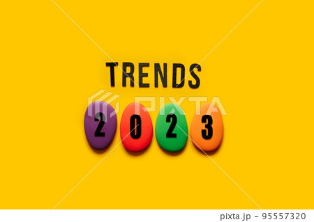 Word trends 2023 with colored blocks on yellow background. Modern trend concept banner for monitoring new business opportunities. 95557320