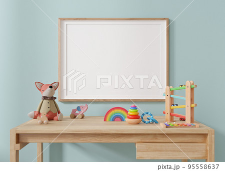 Empty horizontal picture frame hanging on blue wall in modern child room. Frame mock up in contemporary style. Free, copy space for picture, poster. Plush and wooden toys. Close up view. 3D rendering. 95558637