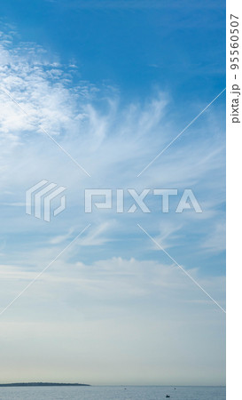 BANNER, VERTICAL STORY Atmosphere panorama white cloud clear blue sky horizon line calm empty sea. Concept paradise life. Design relax wallpaper background. More tone format in stock 95560507