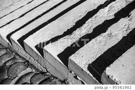 White concrete stairs with dark shadows, abstract photo 95561902