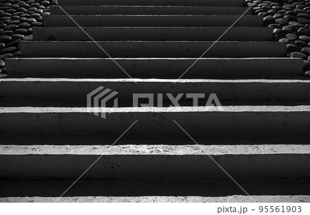 Dark concrete stairs with deep shadows, front view 95561903