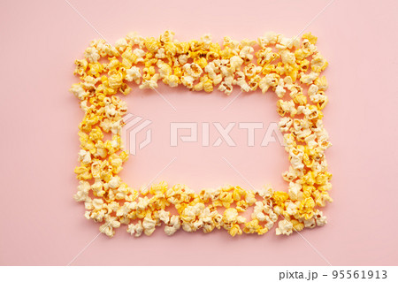 Food. Frozen Popcorn Corn Delicious Yellow Popcorn on Pink Background. Cinema. Copyspace. Place for Text. 95561913