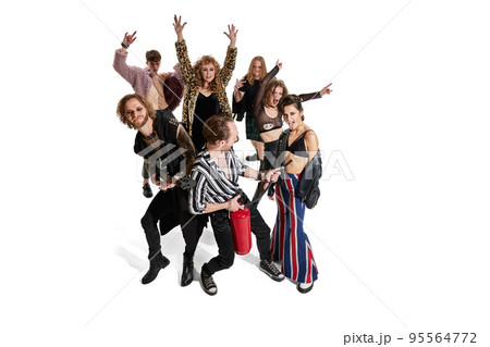 Group of stylish expressive people, man and woman, rock music performers posing over white background. Top view 95564772