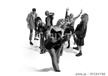 Group of stylish people, man and woman, performing. Rock and roll era. Expressive performance. Black and white photography Group of stylish people, man and woman, performing. Rock and roll era. Expressive performance. Black and white photography 95564786