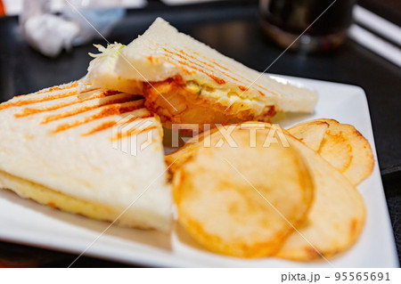Close up shot of delicious Shrimp sandwich with chips 95565691