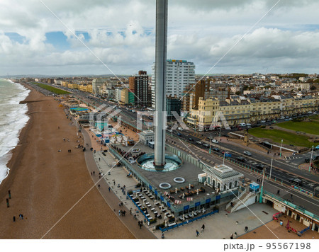 Aerial view of British Airways i360 observation deck in Brighton, UK. Beautiful tower with tourists exploring Brighton by the sea with an amazing view. Aerial view of British Airways i360 observation deck in Brighton, UK. Beautiful tower with tourists exploring Brighton by the sea with an amazing view. 95567198