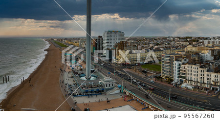 Aerial view of British Airways i360 observation deck in Brighton, UK. Beautiful tower with tourists exploring Brighton by the sea with an amazing view. 95567260
