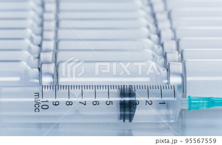 Medicine, Injection, vaccine and disposable syringe, drug concept. Sterile vial medical syringe needle. Glass medical ampoule vial for injection. Medicine, Injection, vaccine and disposable syringe, drug concept. Sterile vial medical syringe needle. Glass medical ampoule vial for injection. 95567559