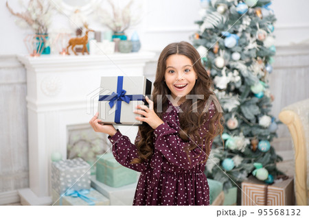 Cute little child girl with xmas present. The morning before Xmas. christmas family holiday. happy new year. Christmas shopping. waiting for santa. Winter. Have a holly jolly Christmas Cute little child girl with xmas present. The morning before Xmas. christmas family holiday. happy new year. Christmas shopping. waiting for santa. Winter. Have a holly jolly Christmas 95568132