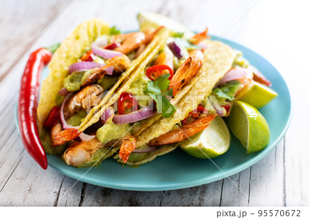 Mexican tacos wih shrimp and vegetables Mexican tacos wih shrimp and vegetables 95570672